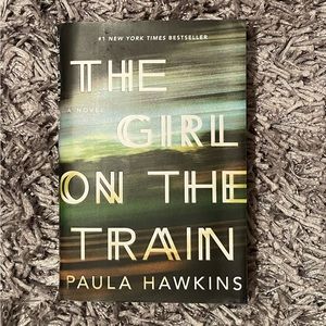 The Girl on the Train hardcover novel by Paula Hawkins. Like new condition.